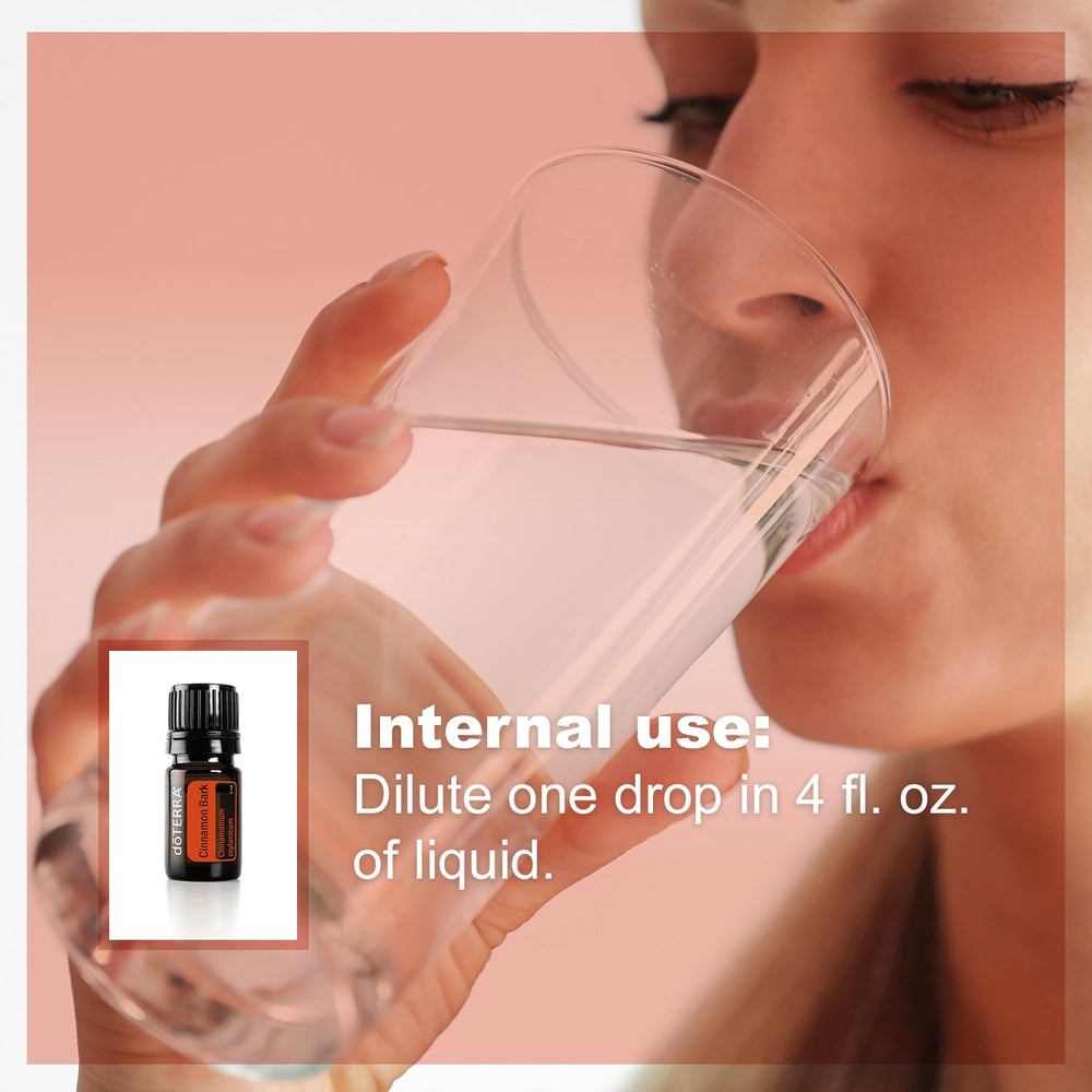 doTERRA Cinnamon essential oil bottle and tea cup suggesting comforting beverages