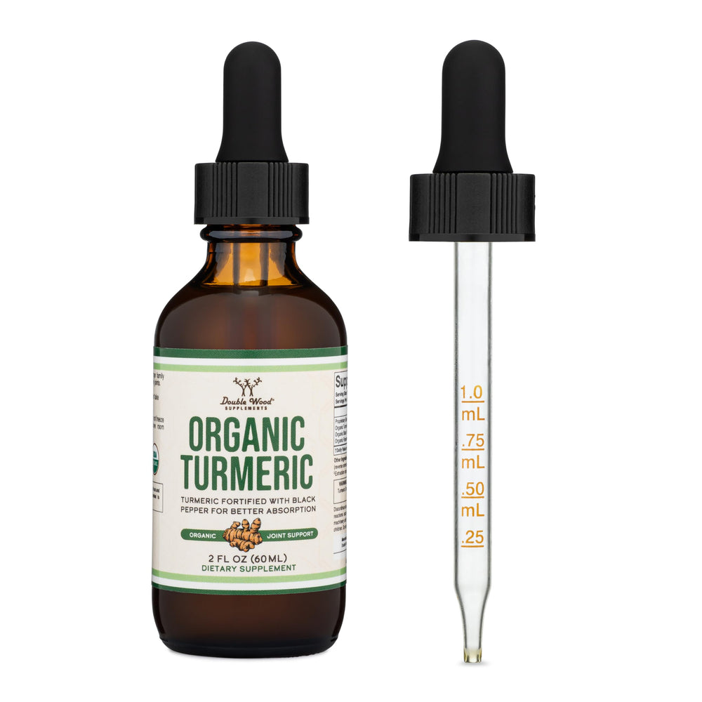 Double Wood Turmeric Drops label close-up with organic and non-GMO icons.