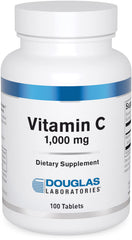 Douglas Laboratories Vitamin C bottle with tablets for daily immune support.