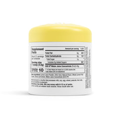 Serving packet of Lemon Sips beside fresh lemons for on-the-go use.