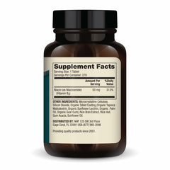 Close-up of 50 mg Niacinamide tablet, small and easy to swallow.