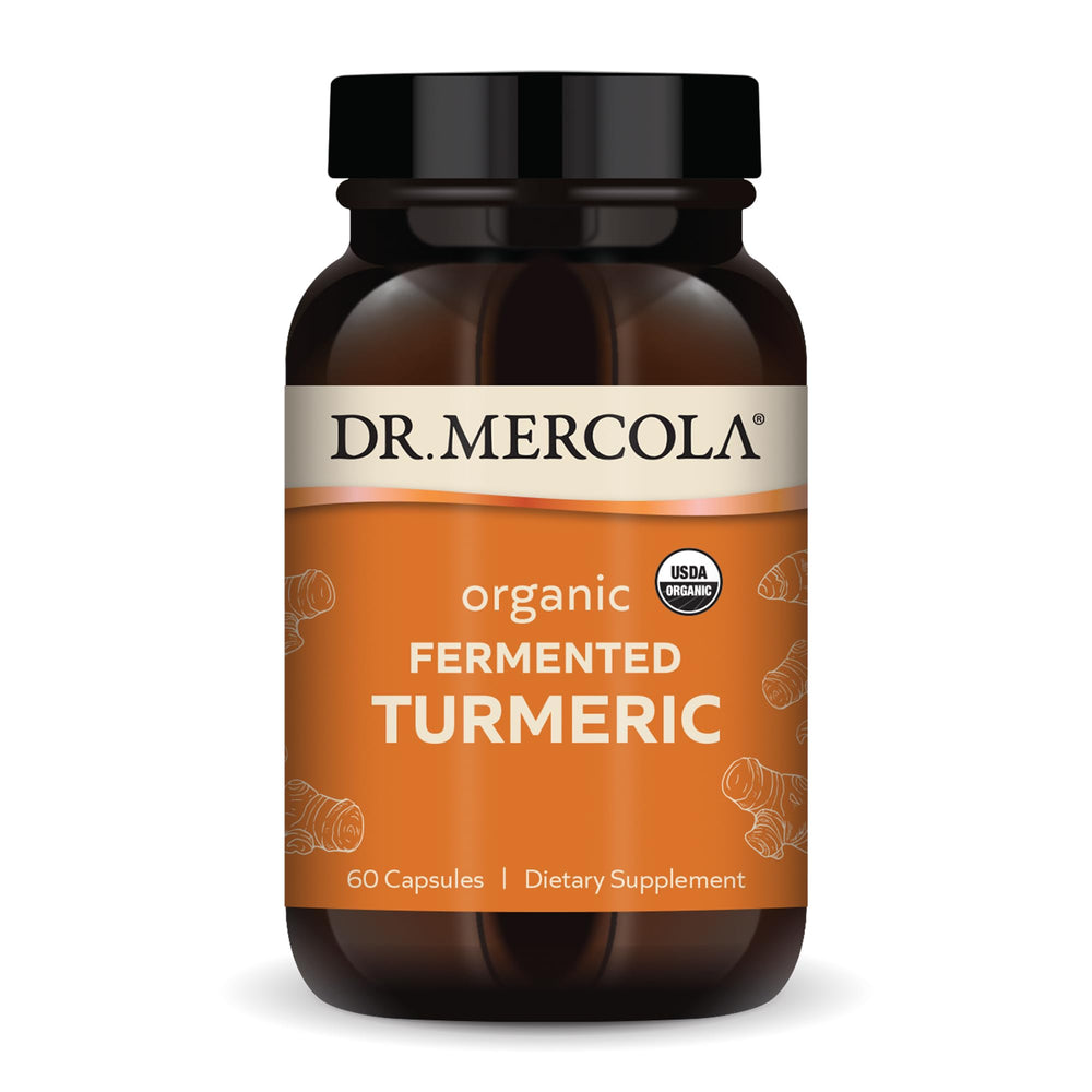 Dr. Mercola Organic Fermented Turmeric bottle on a kitchen counter for daily antioxidant balance.