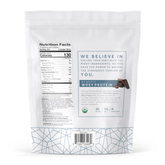 Close-up of Dr. Mercola Pure Power Organic Whey Protein scoop resting on the tub