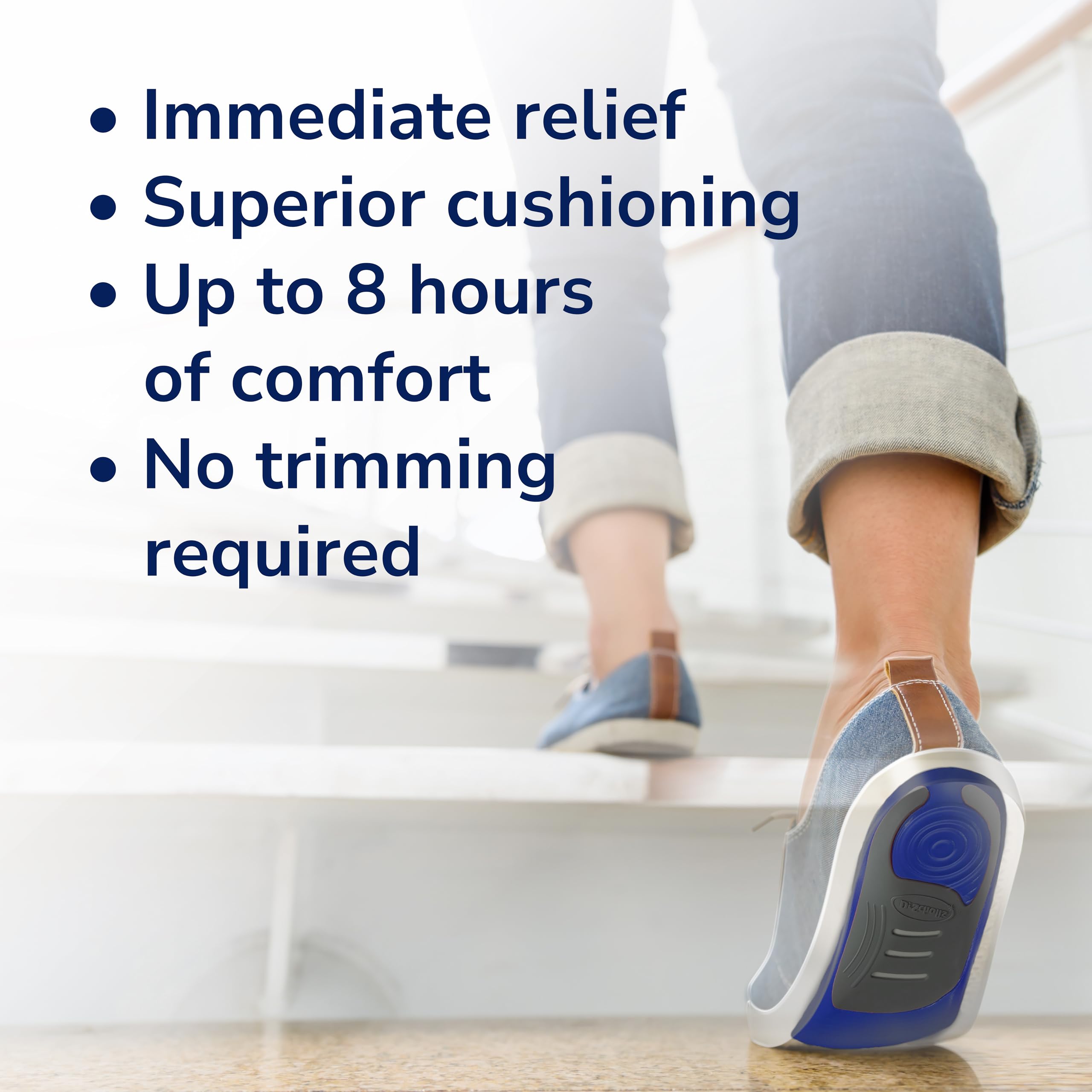 Dr. Scholl's slip-in orthotics placed in sneakers for easy daily switch.