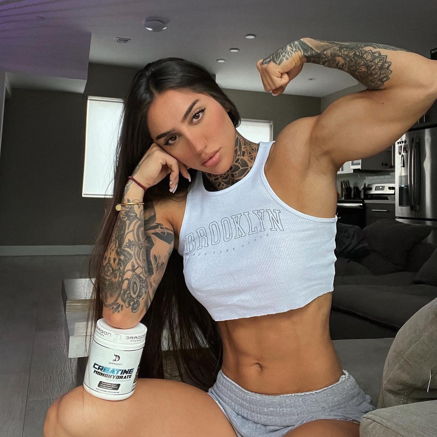 Dragon Pharma Creatine Monohydrate muscle-toned visual suggesting strength gains.