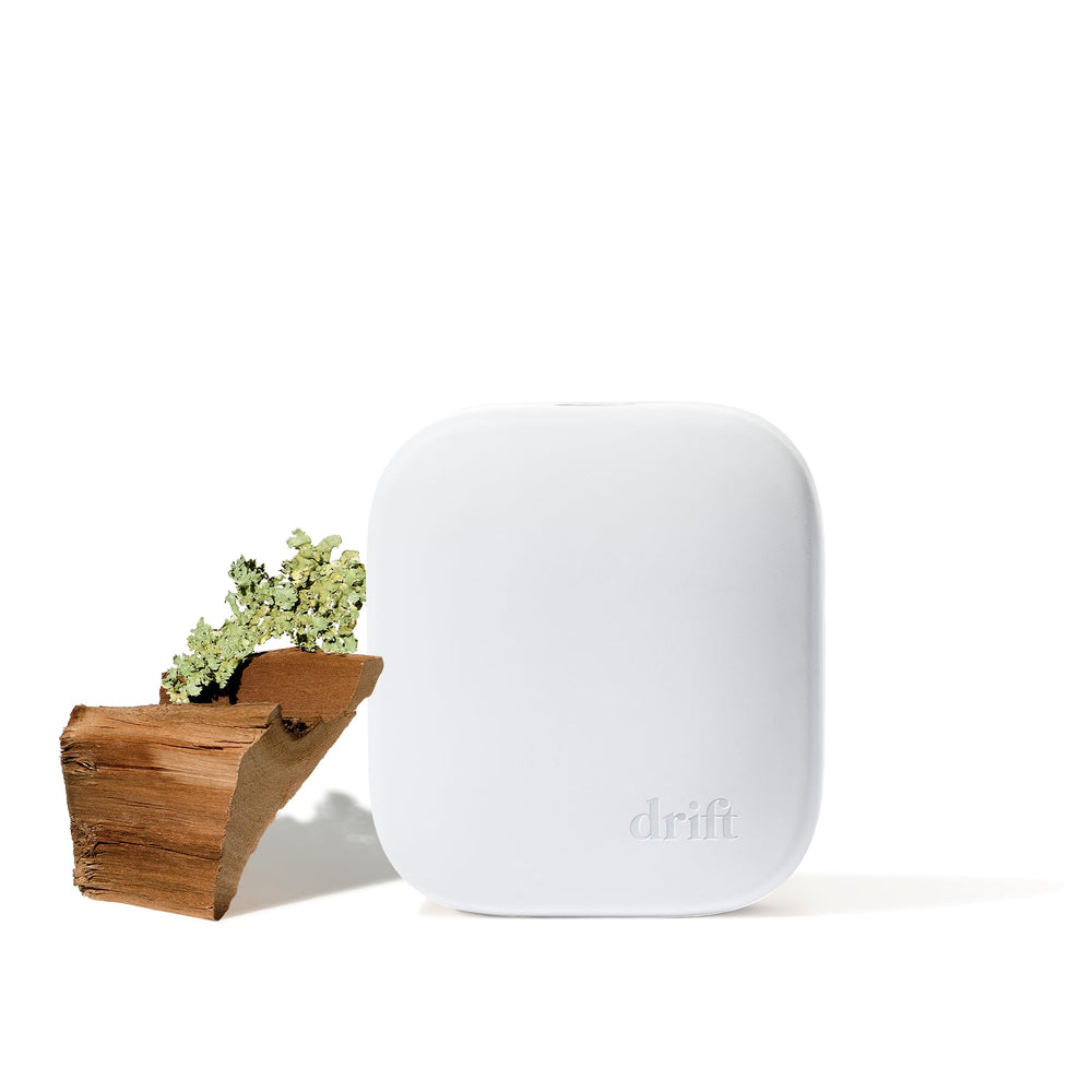 Drift Teak diffuser bottle with adjustable scent levels for a cozy space.