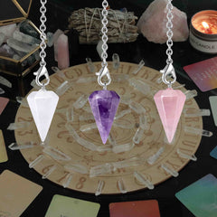 DUQGUHO crystal pendulum in use for dowsing and yes/no guidance.