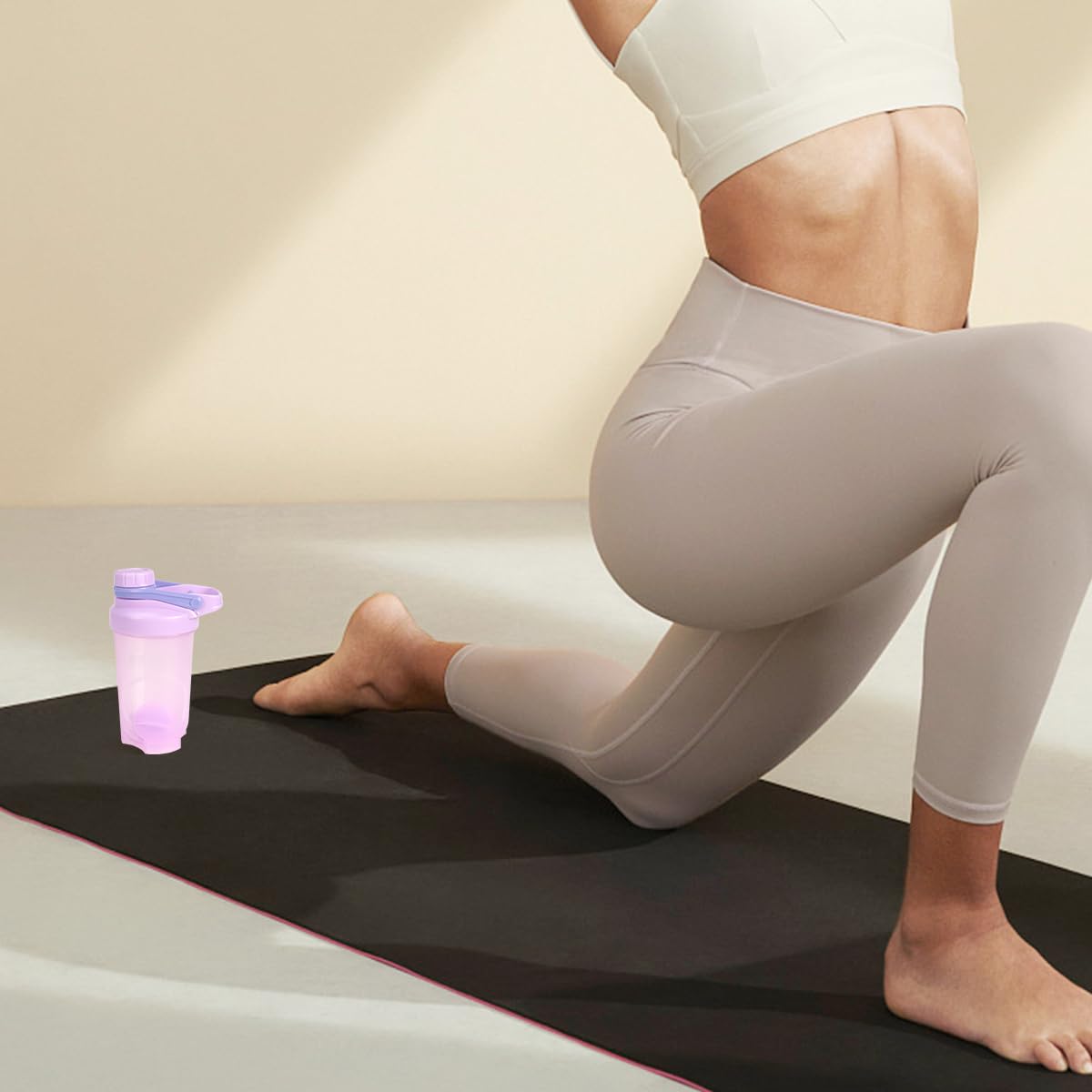 D.Y.A 16oz purple shaker bottle portable top loop for carrying between workouts.