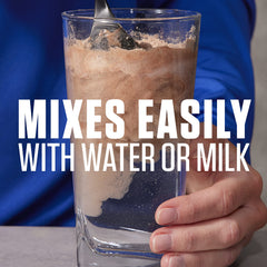 Dymatize Elite Casein Chocolate shake in glass with creamy texture.