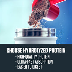 Scoop beside glass, ideal for on-the-go protein.
