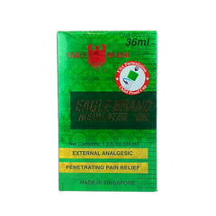 Eagle Brand medicated oil being poured for easy topical application.