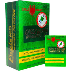 Eagle Brand Natural Medicated Oil bottle close-up with green color and herbal aroma.