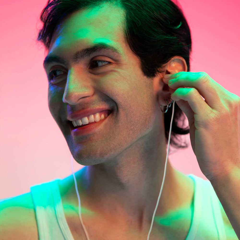 Eargasm white cord around the neck for slide earplugs, easy removal