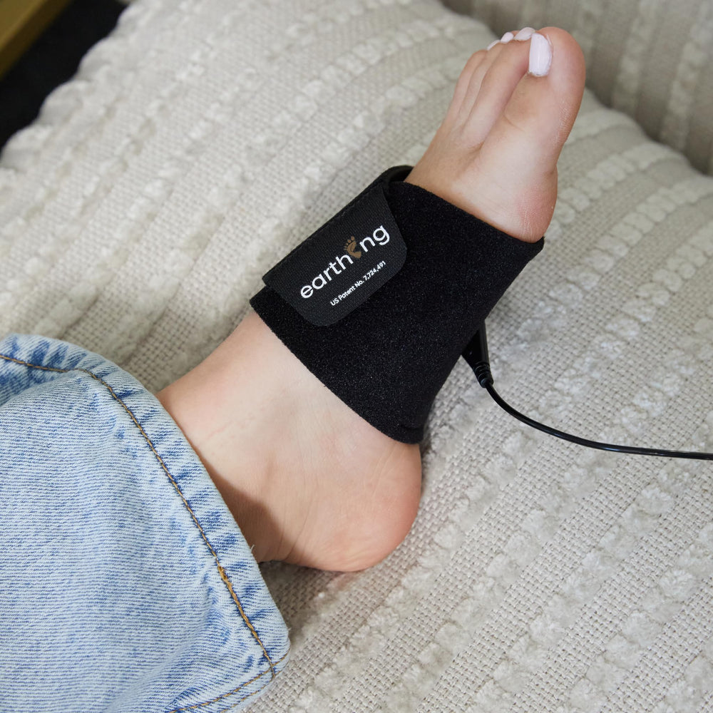 Earthing Universal Band connected to grounded outlet illustration enables portable grounding