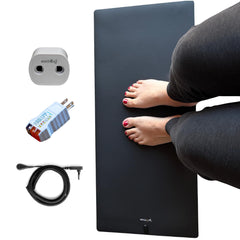 Earthing Universal Mat Kit grounding mat in use at a desk for focused grounding.