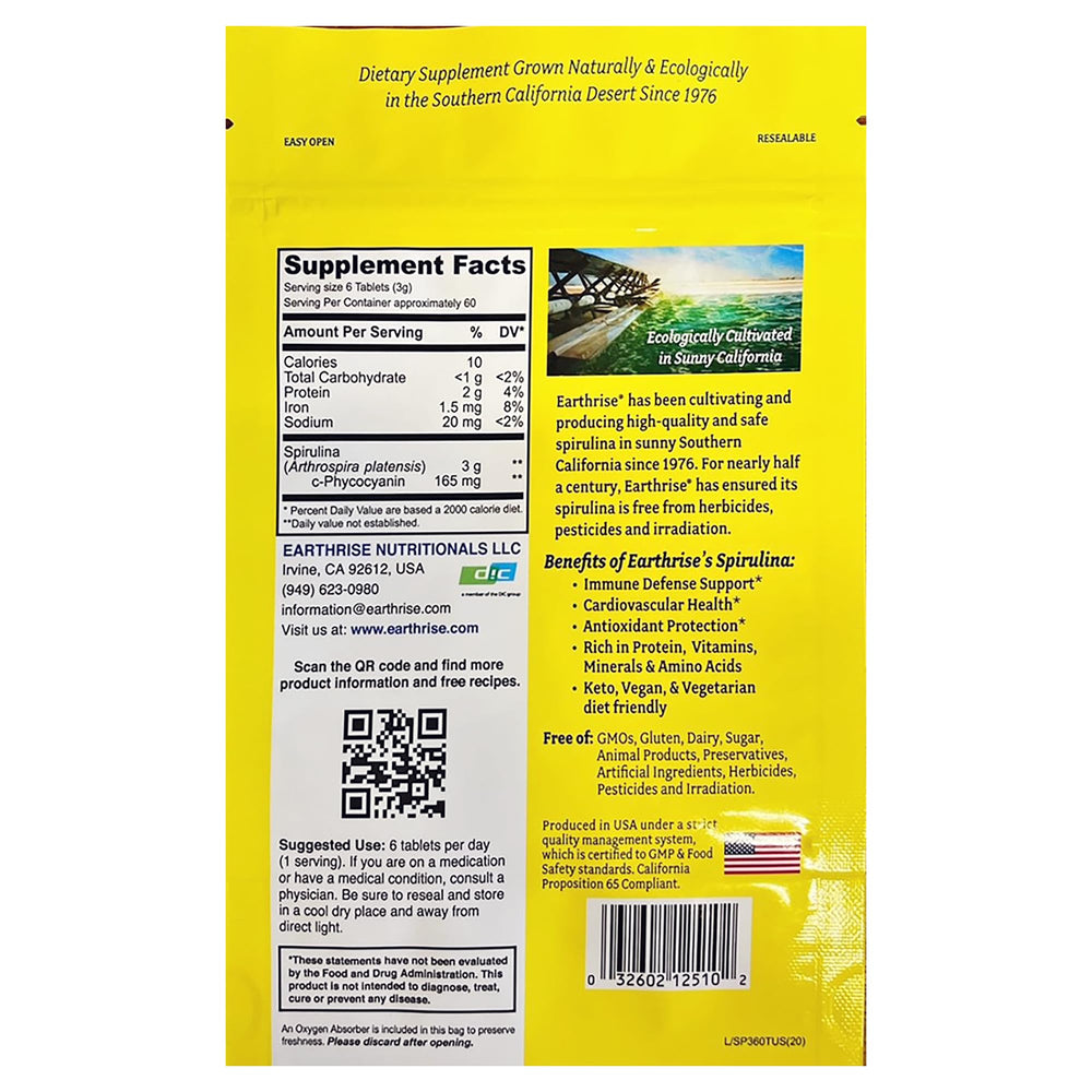 Earthrise spirulina 500mg tablets closeup, bright green pills rich in nutrients.