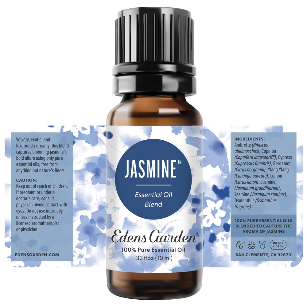 Edens Garden Jasmine Blend placed with ambient lighting for romantic self-care mood.