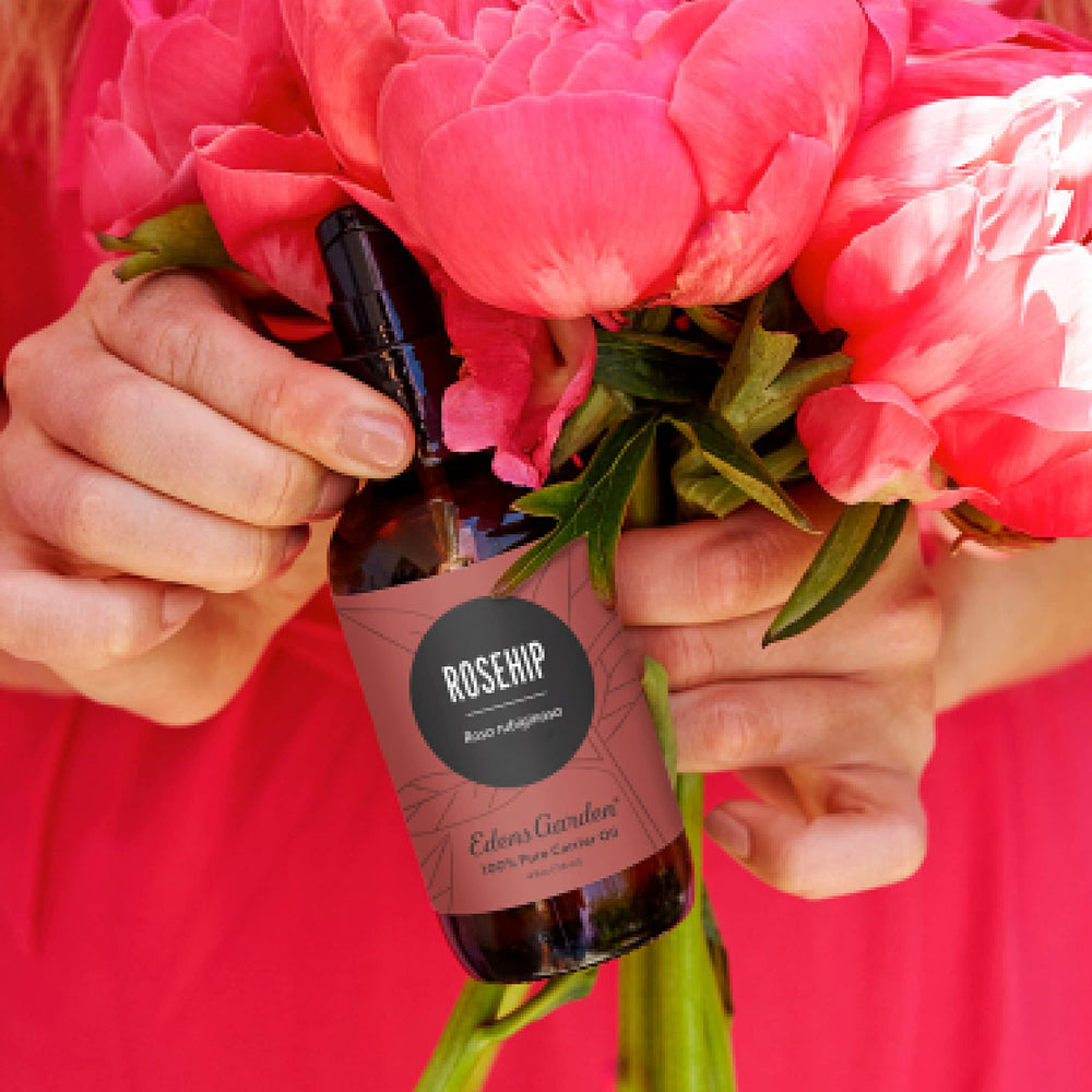 Edens Garden Rosehip Carrier Oil bottle with dropper showing pure golden hydration for skin.