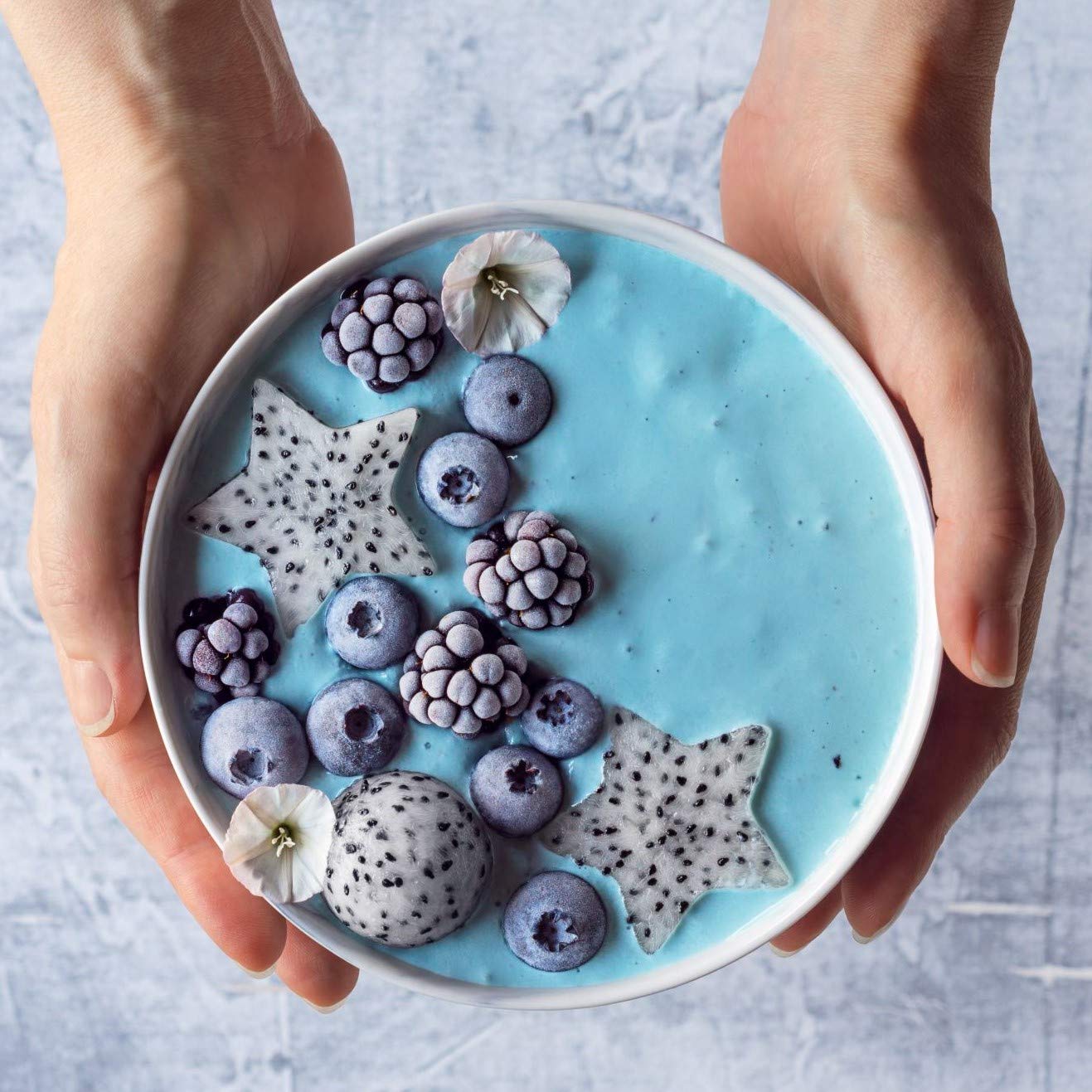 Yogurt with Ellie's Best blue spirulina powder tint and subtle color.