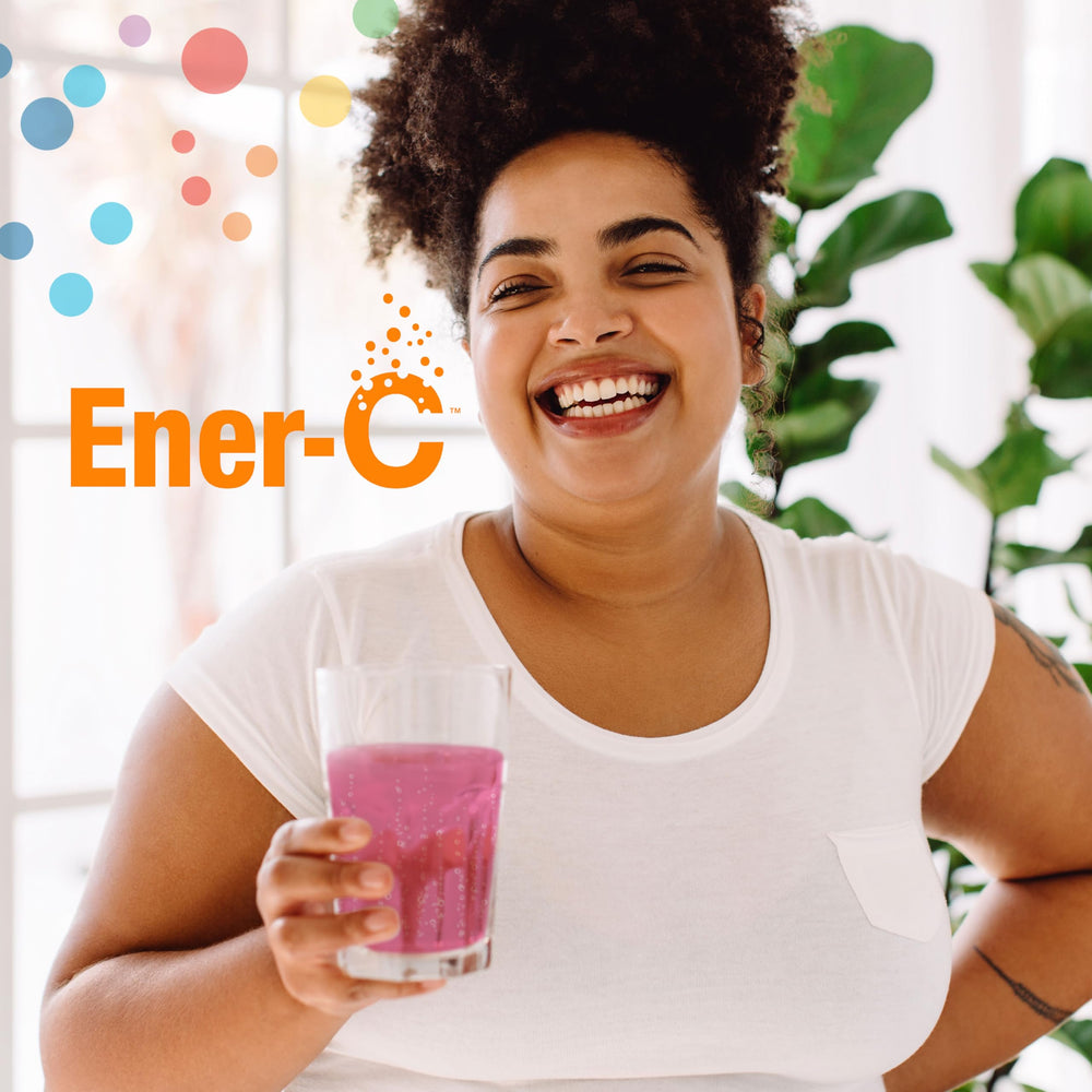 Ener-C glass of water dissolving vitamin powder.