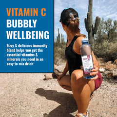 Ener-C sugar-free energy mixed berry dissolving in water for quick refreshment.