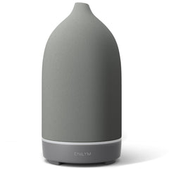 ENILYM aromatherapy diffuser in grey ceramic with a 9-color mood light for relaxing ambience.