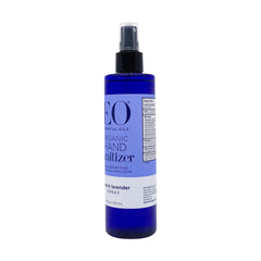 Close-up of EO Organic French Lavender bottle with lavender petals, emphasizing fragrance focus.