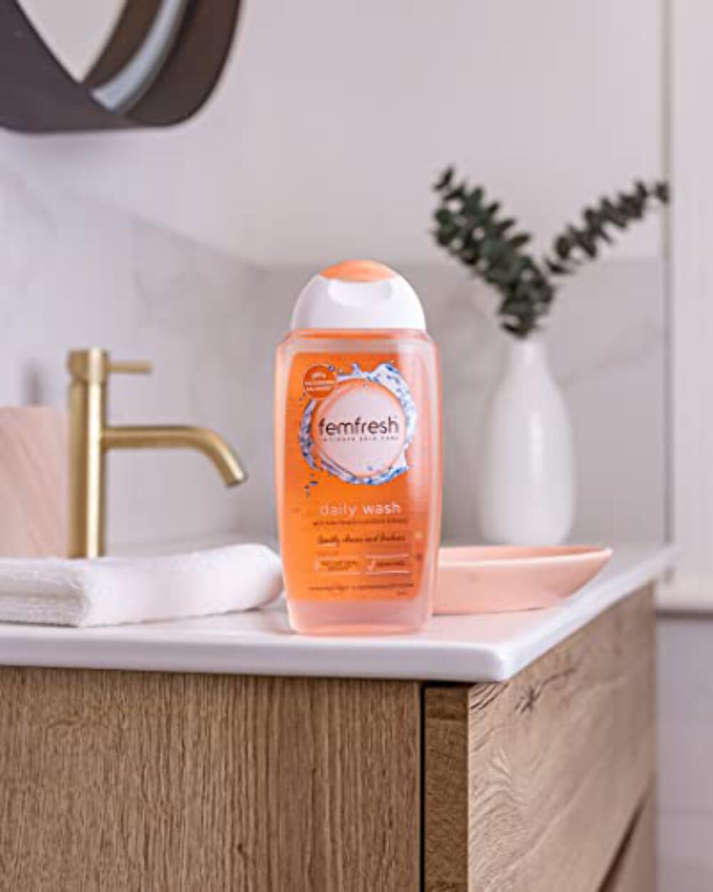 Femfresh Intimate Wash foaming texture closeup showing creamy lather