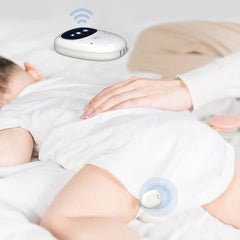 Fency bedwetting alarm receiver placed beside the bed for caregiver alerts