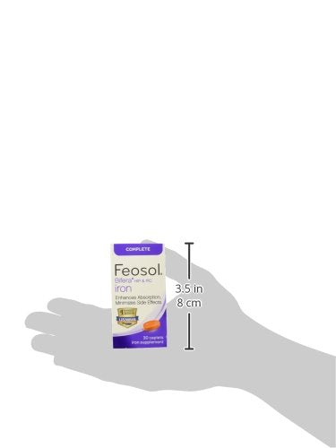 Feosol Complete bottle on kitchen counter with water glass.