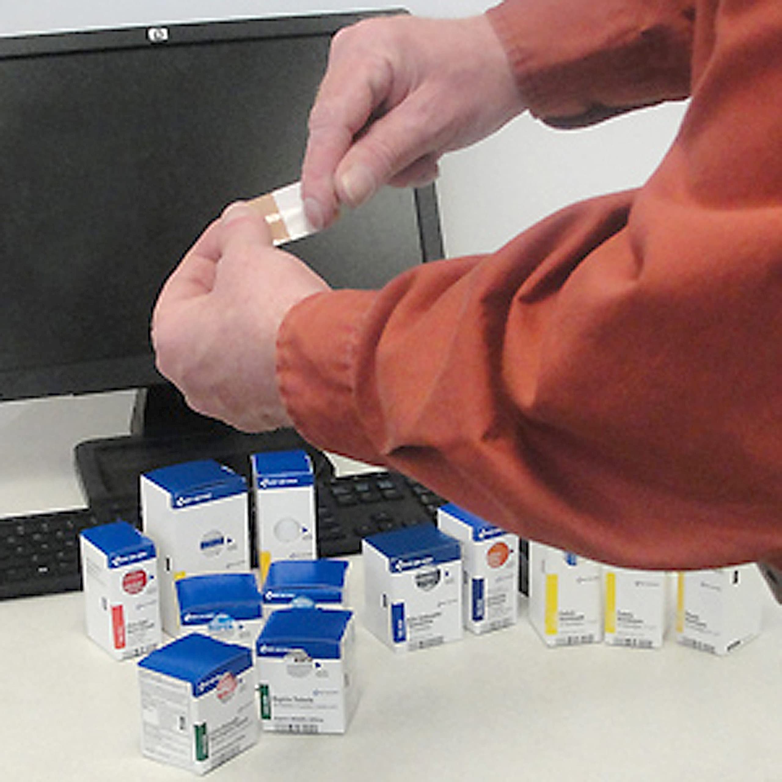 First Aid Only antiseptic towelettes and burn cream ready for use