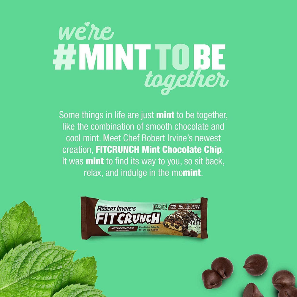 Fit Crunch mint chocolate chip bar bite closeup shows chocolate chips and creamy interior.