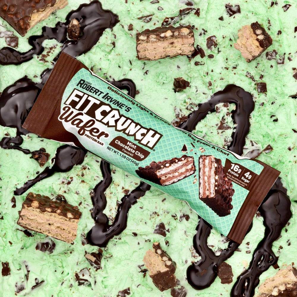 FITCRUNCH Mint Chocolate Chip wafer bars lifestyle shot with gym equipment