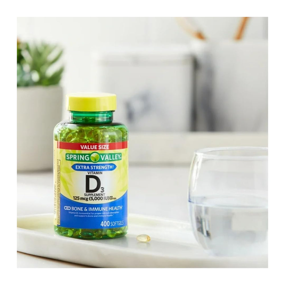 Close-up of 125 mcg (5000 IU) D3 softgels by FitMania aiding calcium absorption.