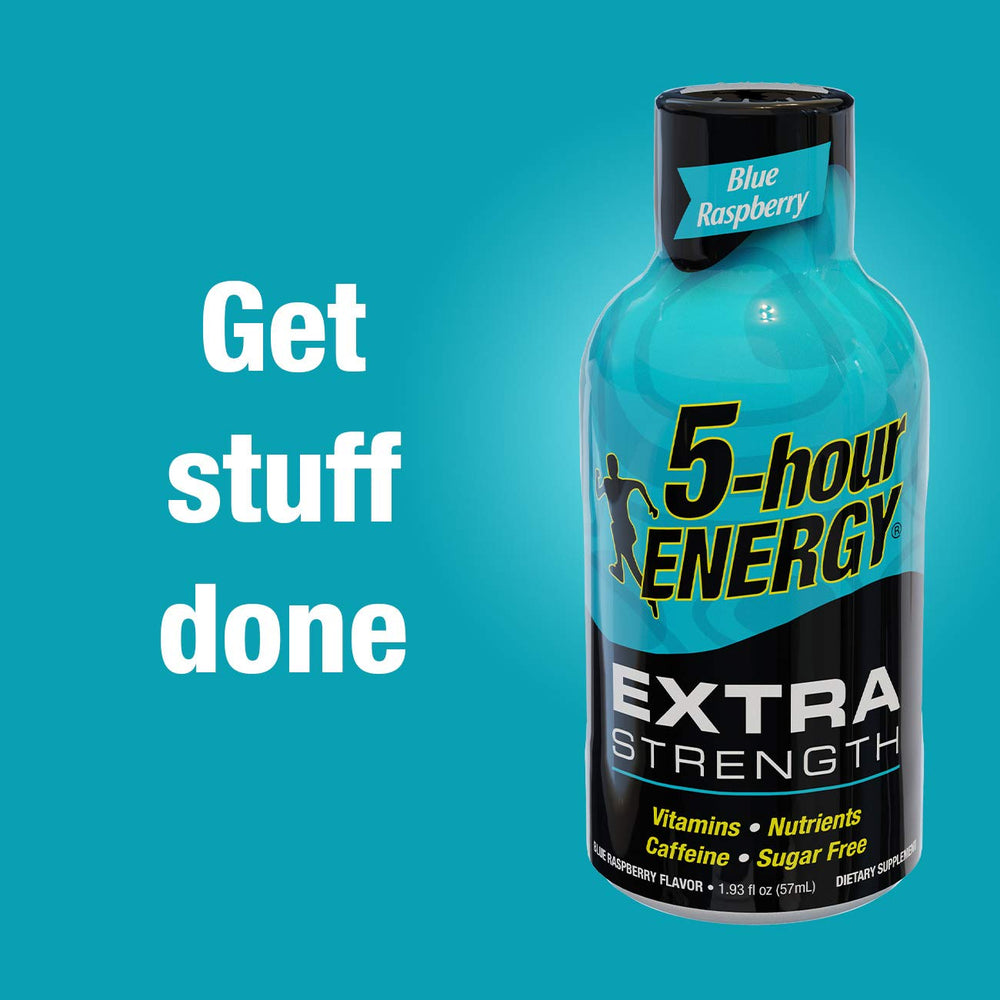Five-hour ENERGY Orange Shot desk-work captures a moment of focused alertness during tasks.