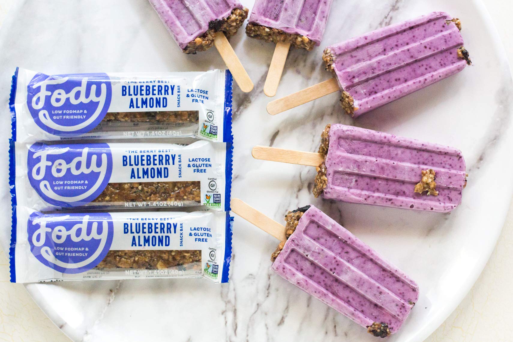 On the go setup featuring Fody Blueberry Almond Bar for quick snacking