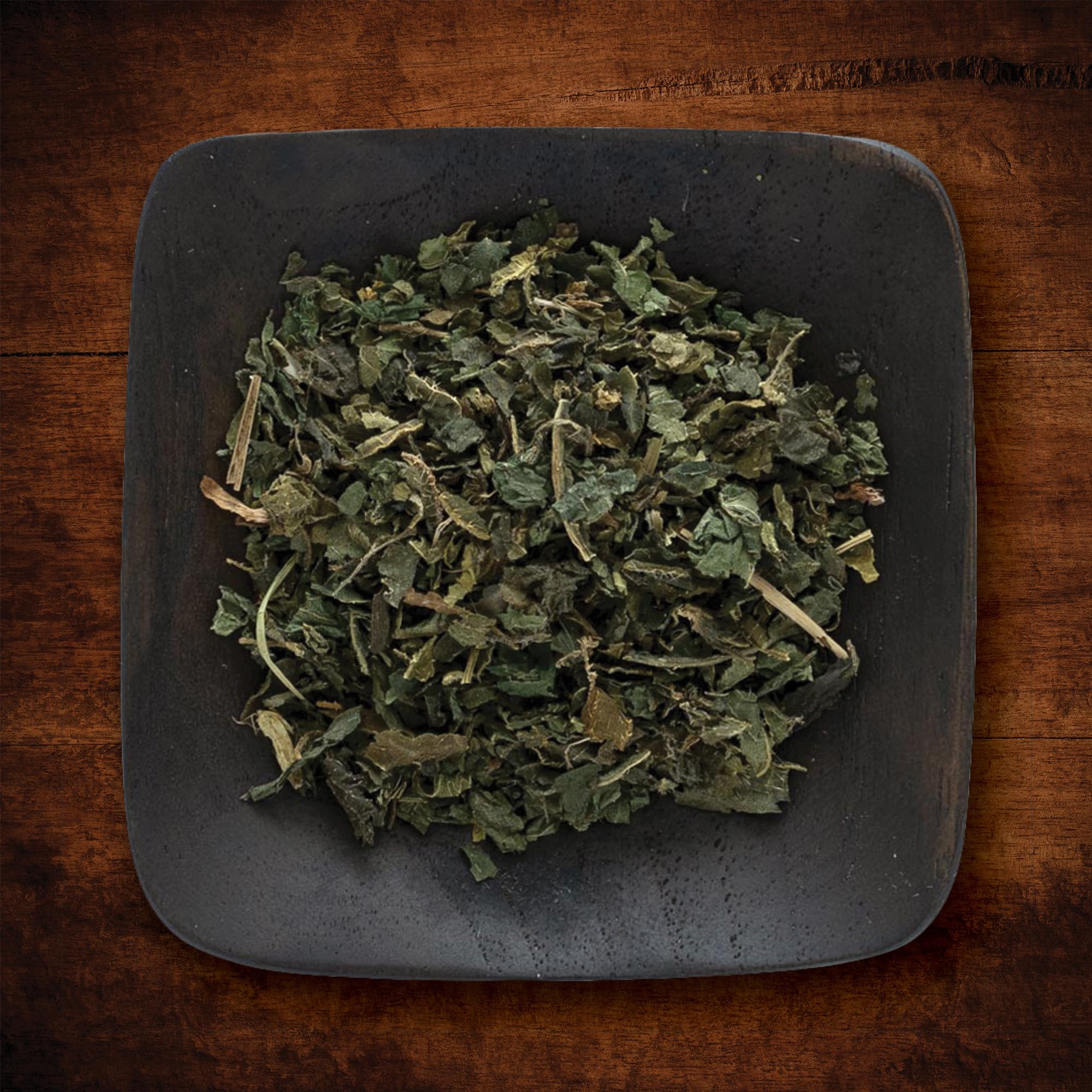 Nettle leaf in a pot adding green depth to soup or stew.