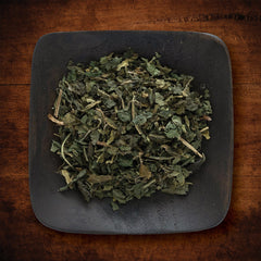 Nettle leaf in a pot adding green depth to soup or stew.