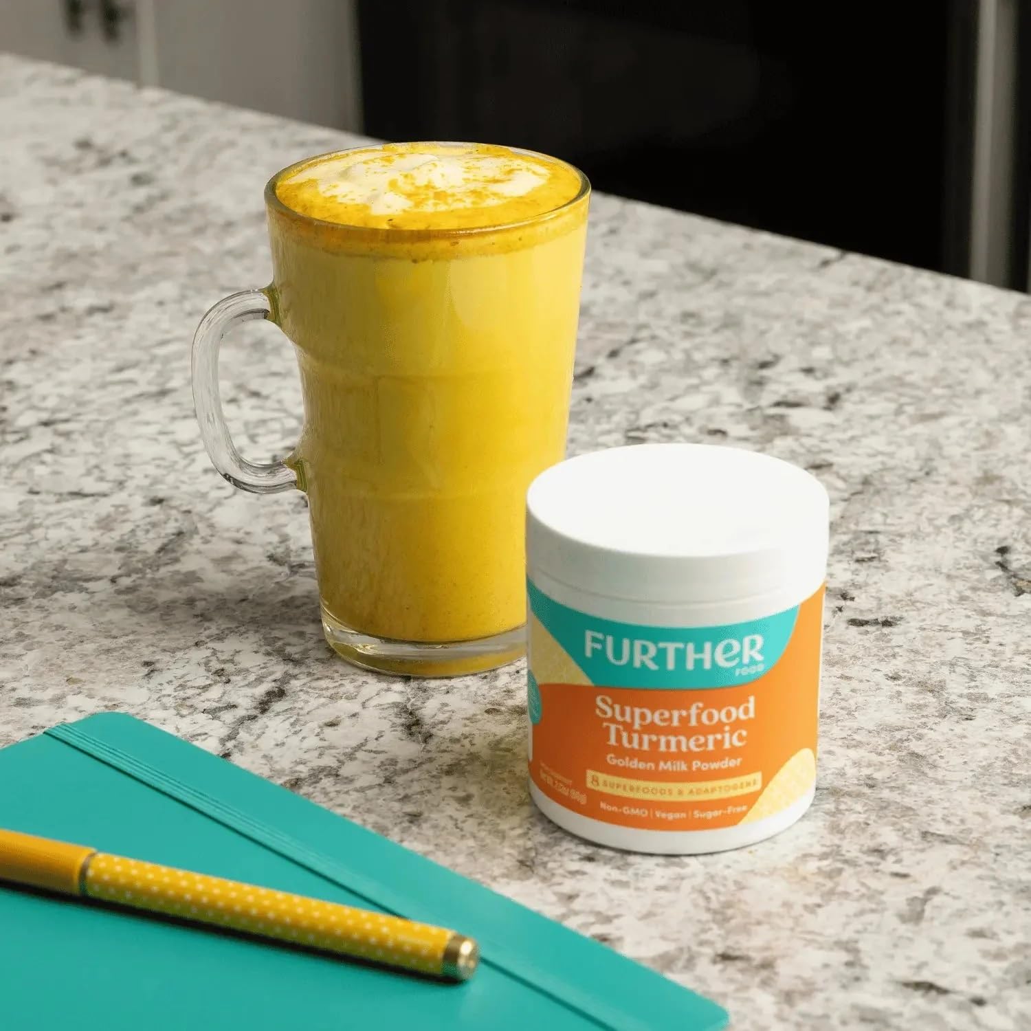 Preparing golden milk with Further Food turmeric powder in a cup.
