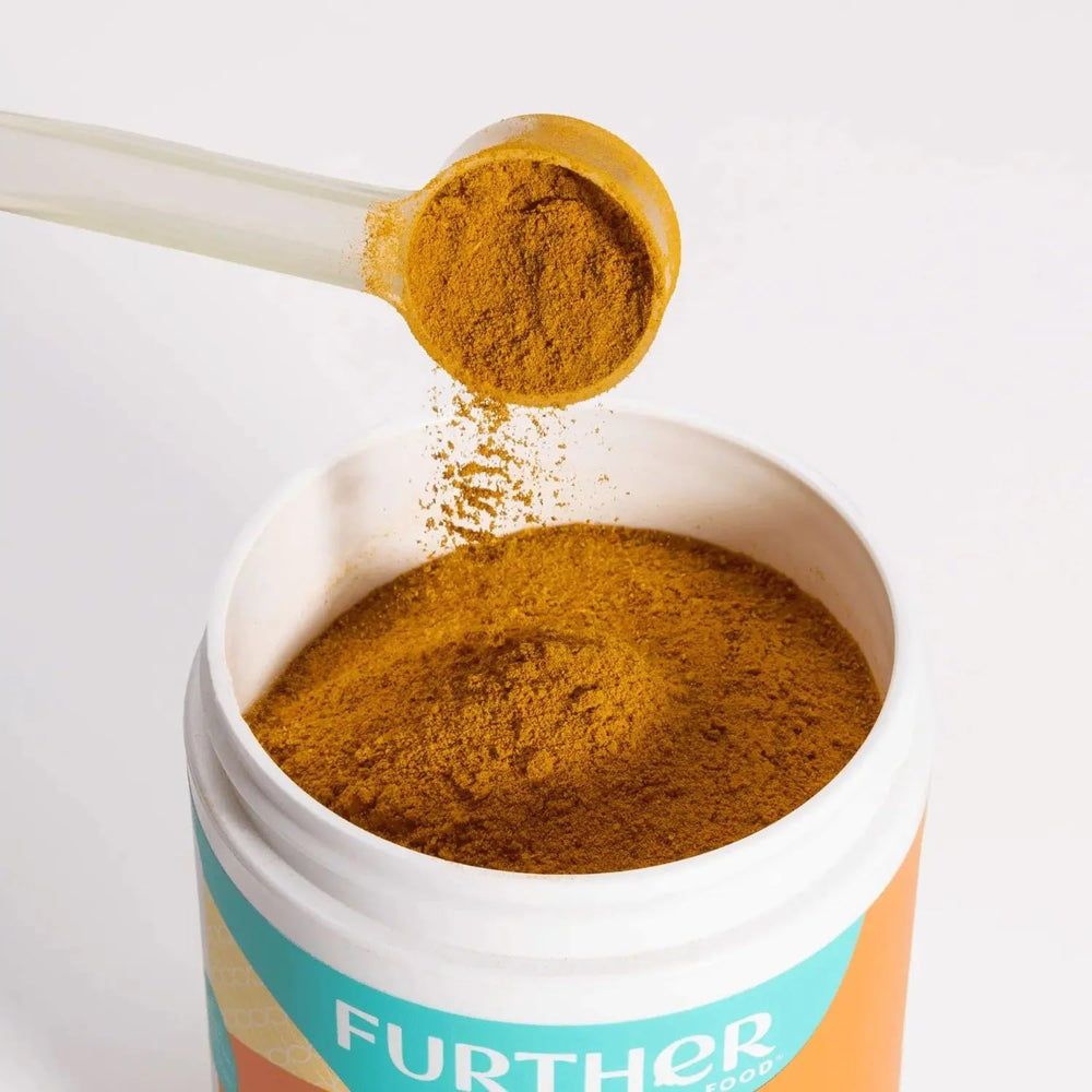 Further Food turmeric powder added to a smoothie for a daily boost.