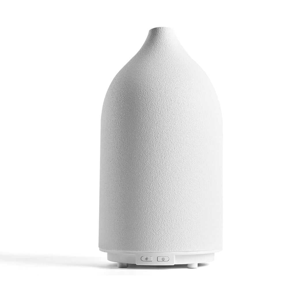 FUSMLI Aroma Diffuser front view with ceramic body and cozy lighting for living spaces