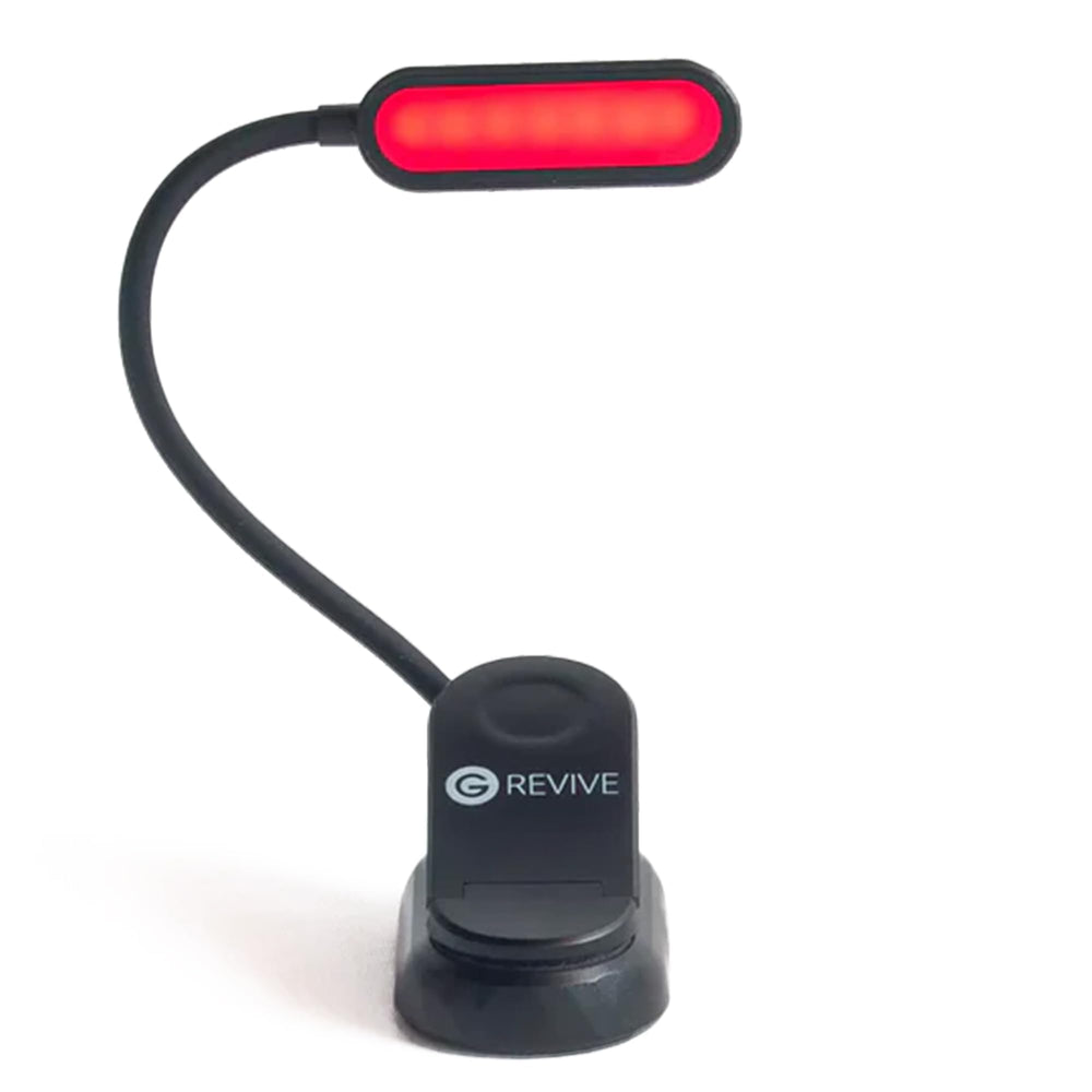 Gamma Revive 670nm red reading light on bed for low-blue-light reading.