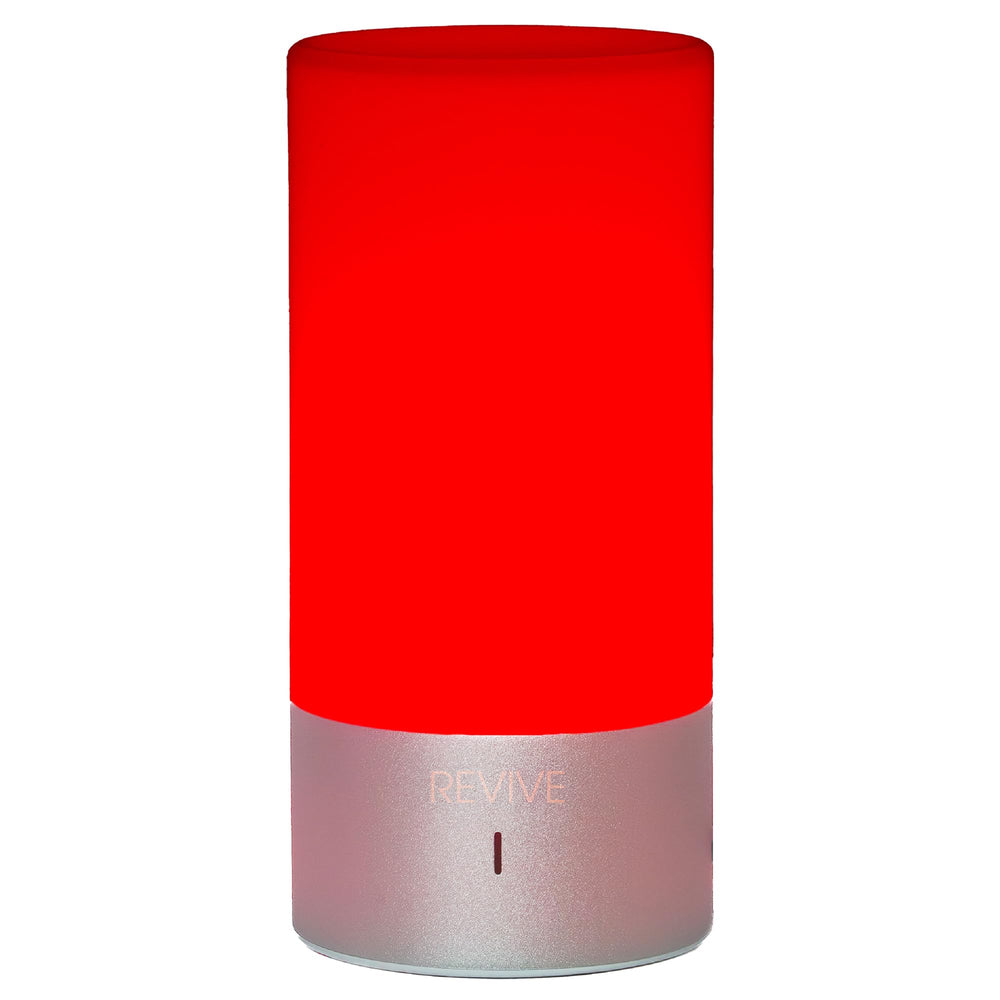 Gamma Revive red light lamp on nightstand provides a soothing bedtime ambiance.