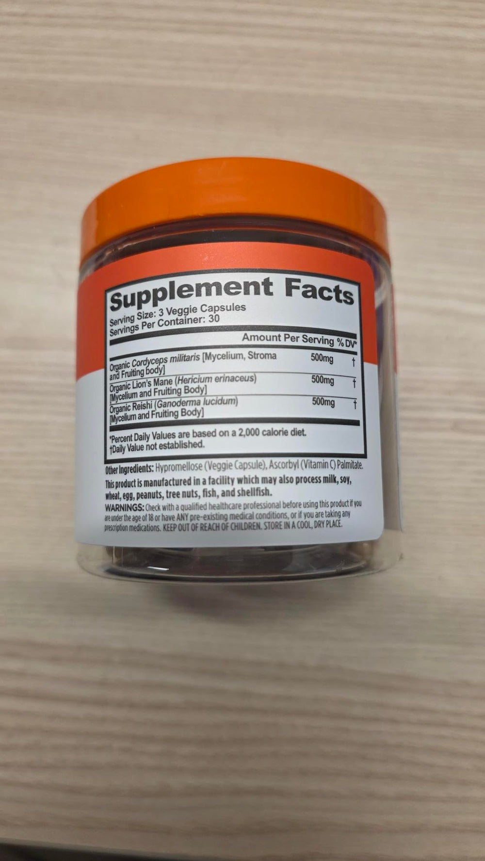 Genius Mushrooms capsules pictured as part of a plant-based wellness routine.