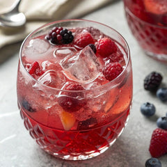 Dissolved Fruit Punch drink in a glass showing vibrant flavor.