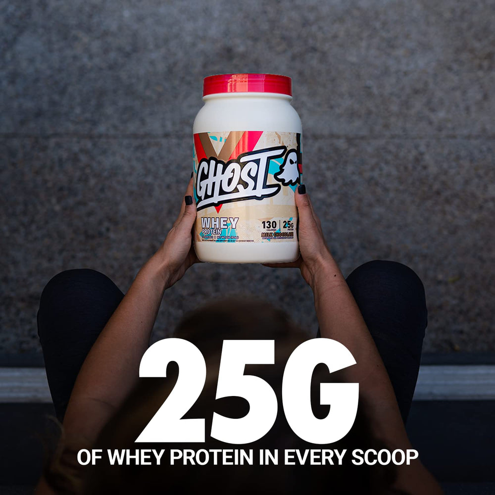 Scoop beside Ghost Whey tub for quick protein boosts.