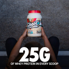 Scoop beside Ghost Whey tub for quick protein boosts.