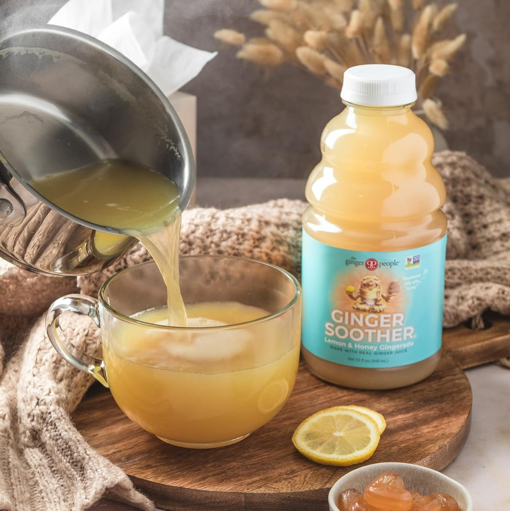 Warm cup of Ginger Soother Gingerade steaming, inviting digestion-friendly warmth.