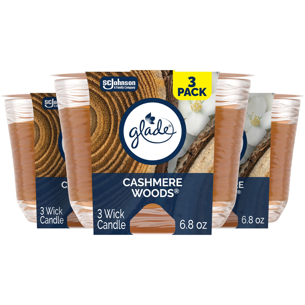 Glade Cashmere Woods 3-Wick Candle jar lights the room with inviting fragrance.