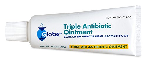 Globe Pharmacy ointment in a first aid kit for quick wound care access.